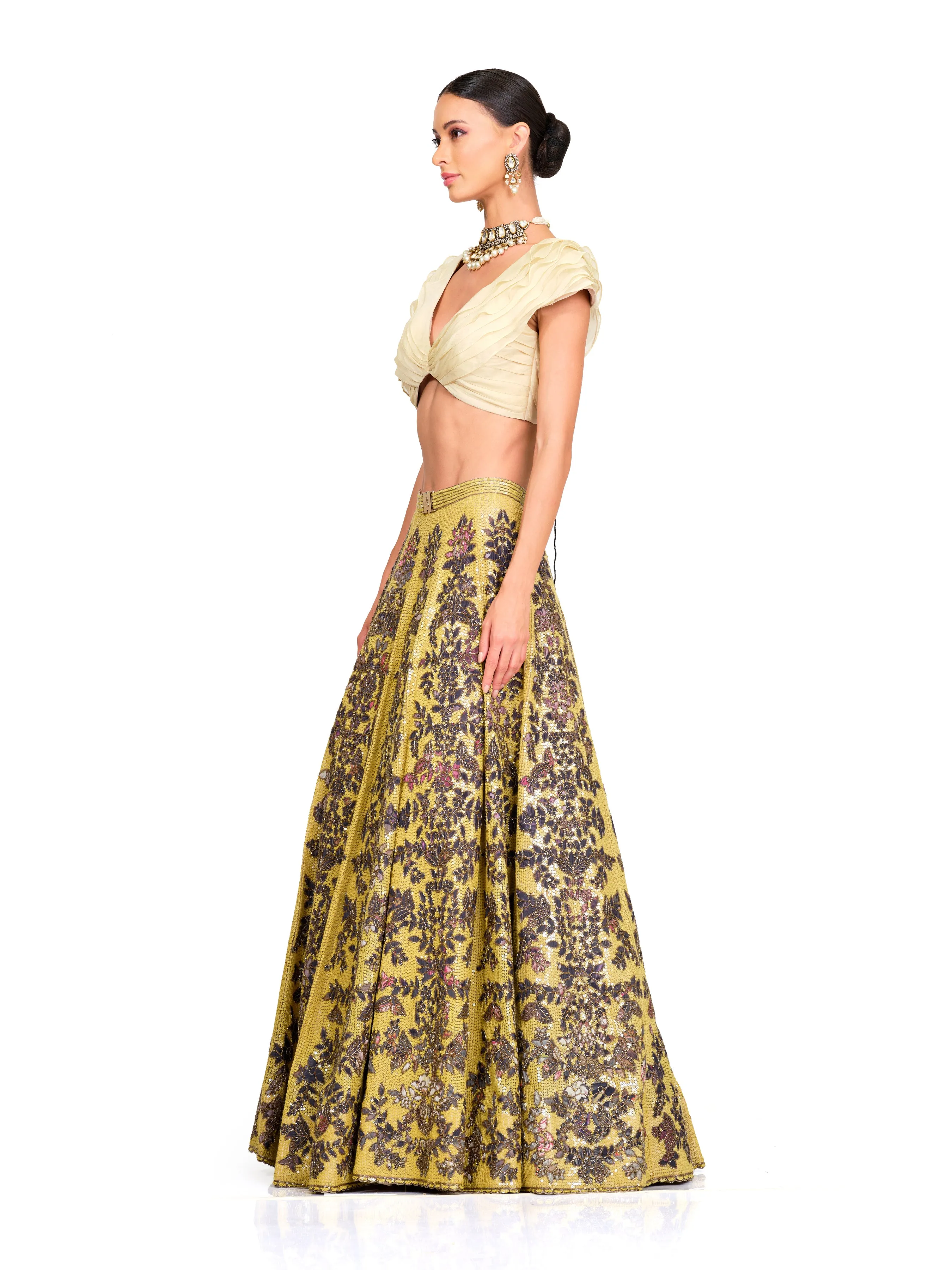 Beige Ruffle Blouse with Heavy Embroidered Sequin Lehenga