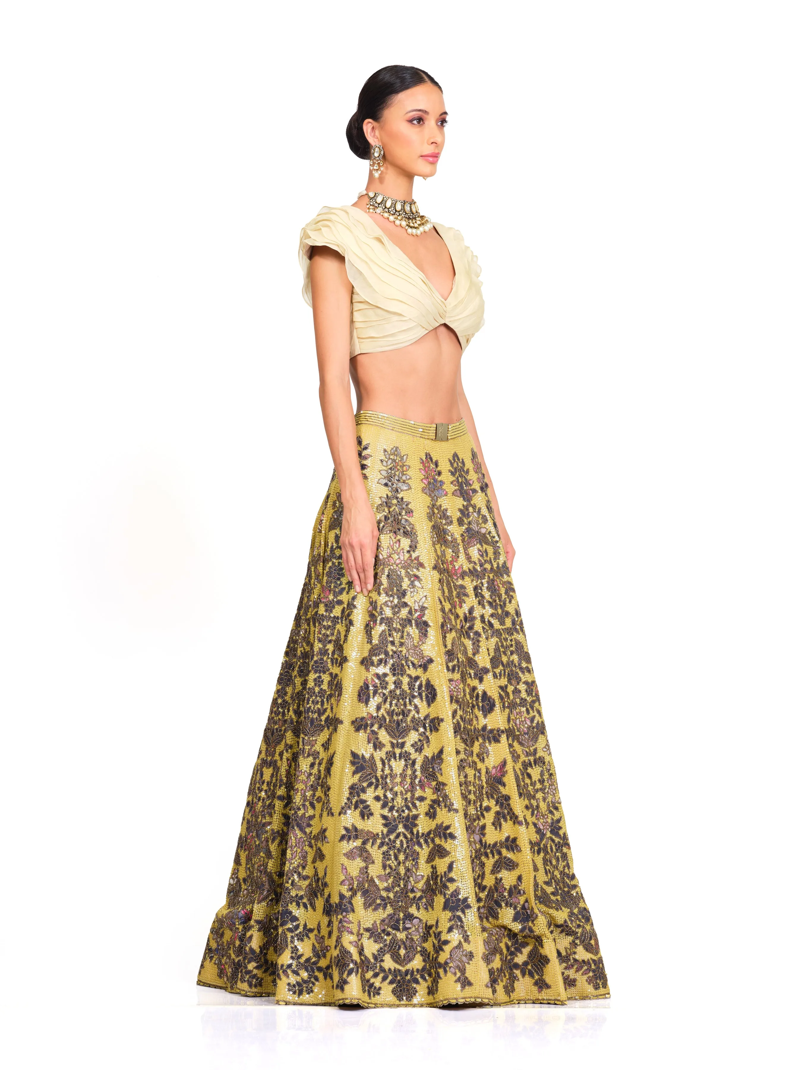 Beige Ruffle Blouse with Heavy Embroidered Sequin Lehenga