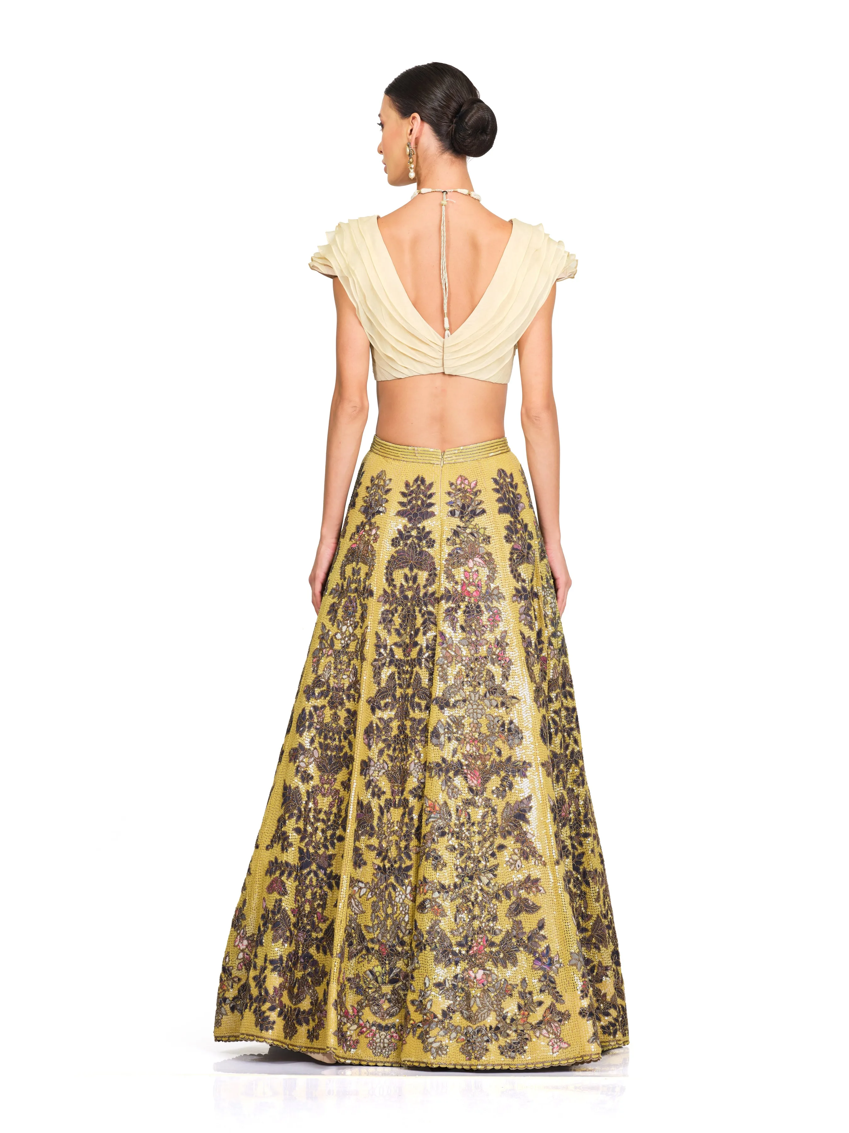 Beige Ruffle Blouse with Heavy Embroidered Sequin Lehenga